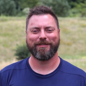 Zach, a pest control professional with Advanced Wildlife and Pest Control, standing in uniform ready to assist with humane wildlife and pest solutions.